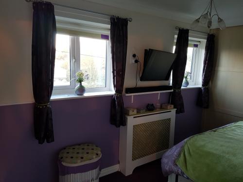 Laundry basket, radiator cabinet and hand-made curtain tie-backs