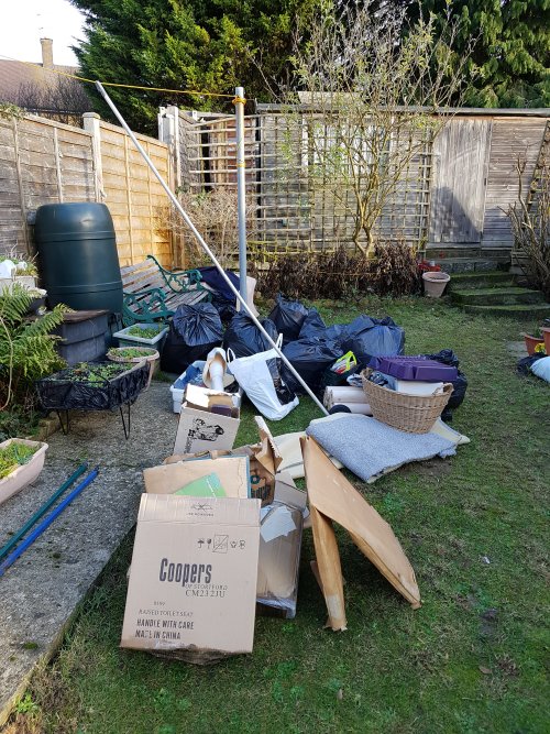 After greenhouse clearance rubbish on lawn