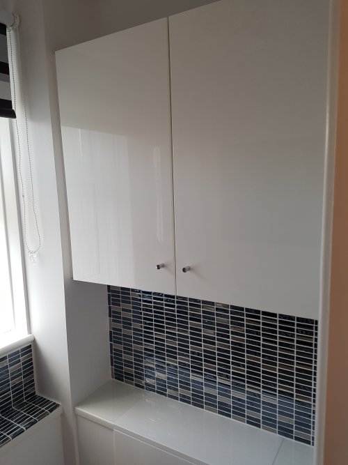 After - Wall and cistern unit tiling, plus wall cupboard