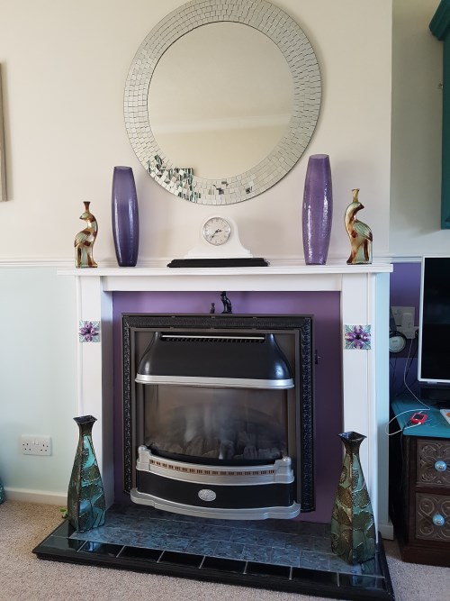 Rejuvenated fireplace, surround painted, new woodwork & tiles