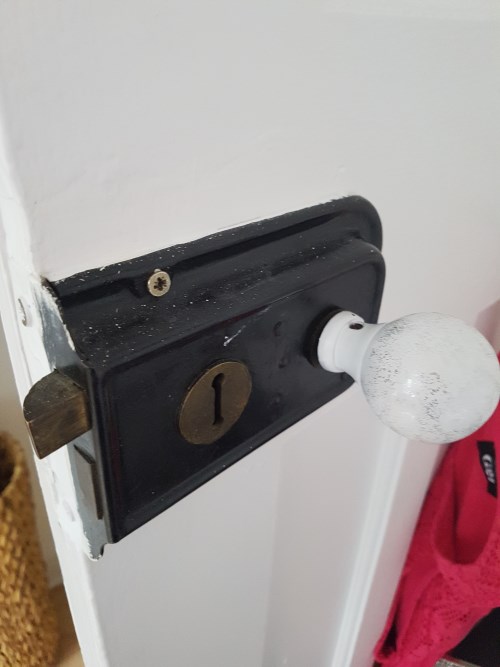 Door latch and knob before